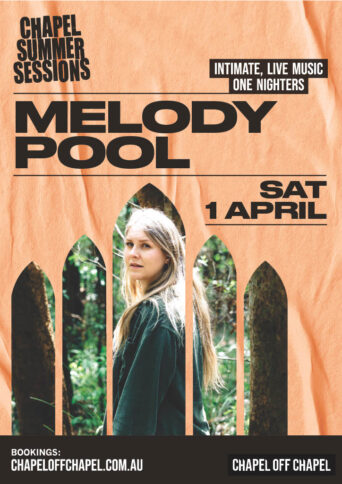 Melody Pool standing in a forest looking over their shoulder