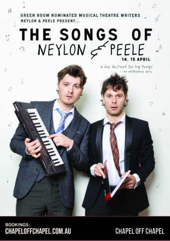 Two people wearing a suit and tie holding a small keyboard and sheet music
