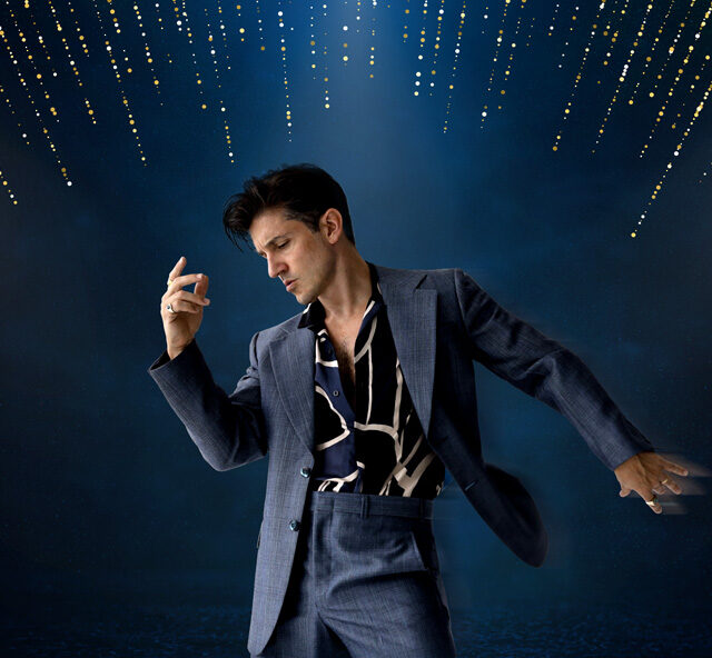 Performer Zoy Frangos posing as Elvis Presley