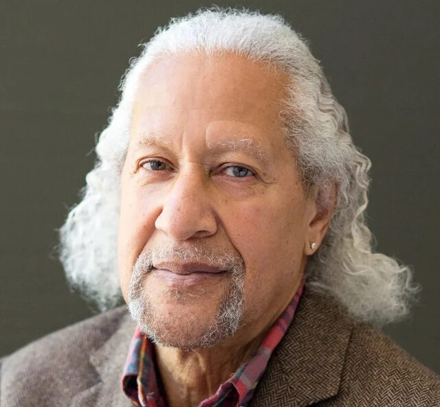 Colour headshot of Gary Bartz with grey hair wearing a jacket