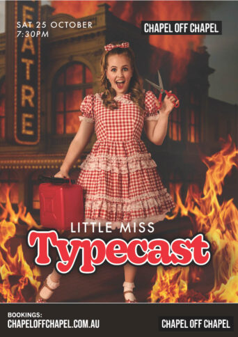 Performer Chloe Halley in a red gingham skirt holding a pair of scissors and laughing