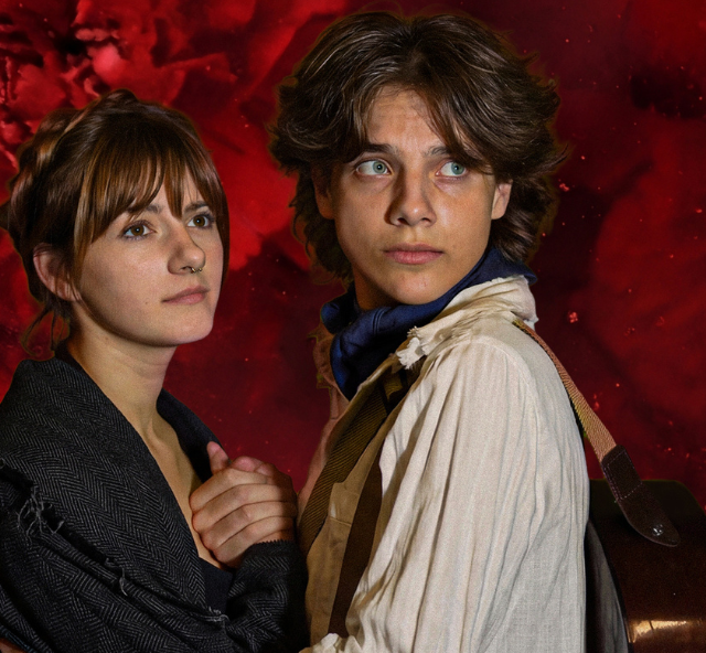 Two people holding hands and looking into the distance