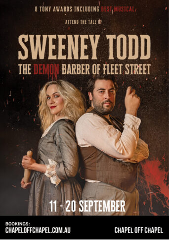 A blonde woman holding a rolling pin stands back-to-back with a bearded man who is gesturing with his hand.