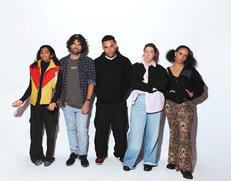 Full body shot of the five artists from Artefact standing alongside each other